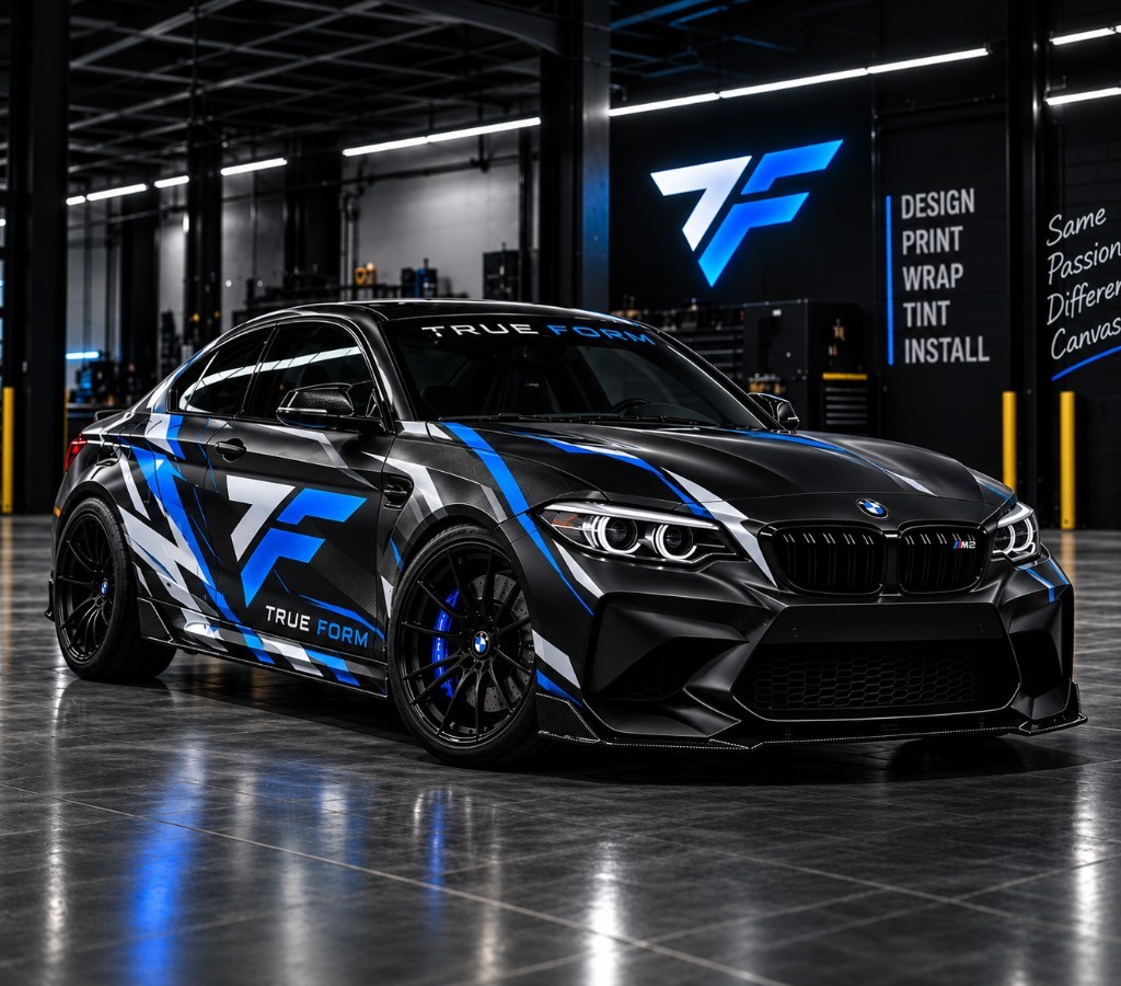 Matte black BMW M2 with TRUEFORM wrap in the shop